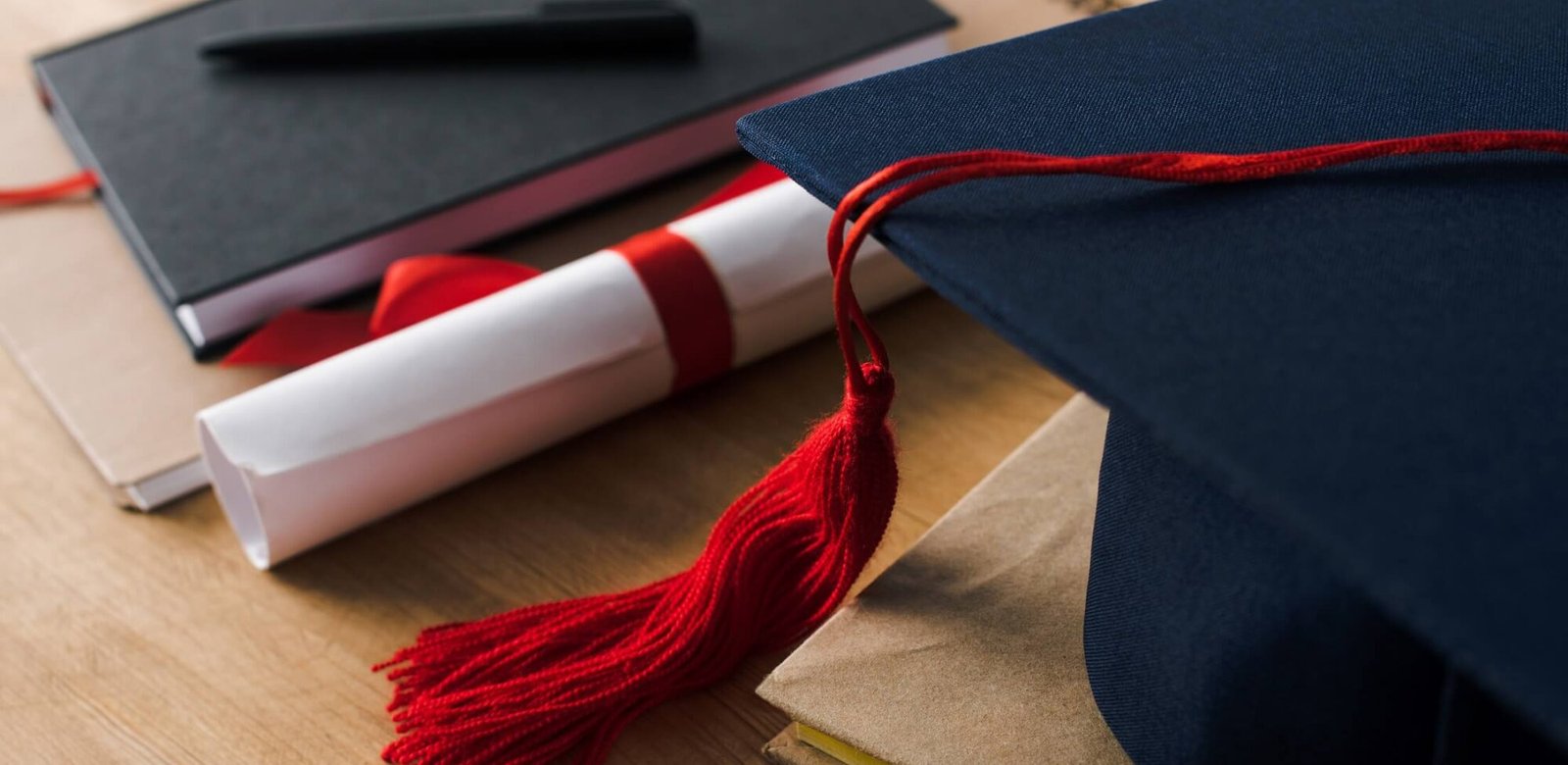 selective focus of notebooks with pen diploma and 3k7p2rq