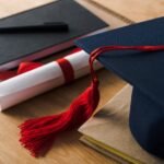 selective focus of notebooks with pen diploma and 3k7p2rq